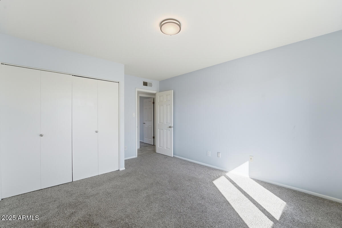 1644 East Broadmor Drive Tempe, AZ 85282 - Photo 15 of 49 a view of a room with rack on the wall
