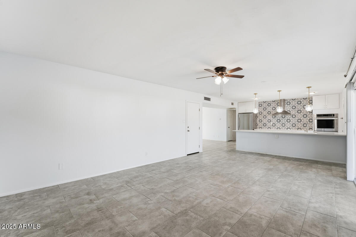 1644 East Broadmor Drive Tempe, AZ 85282 - Photo 21 of 49 a view of an empty room with a window