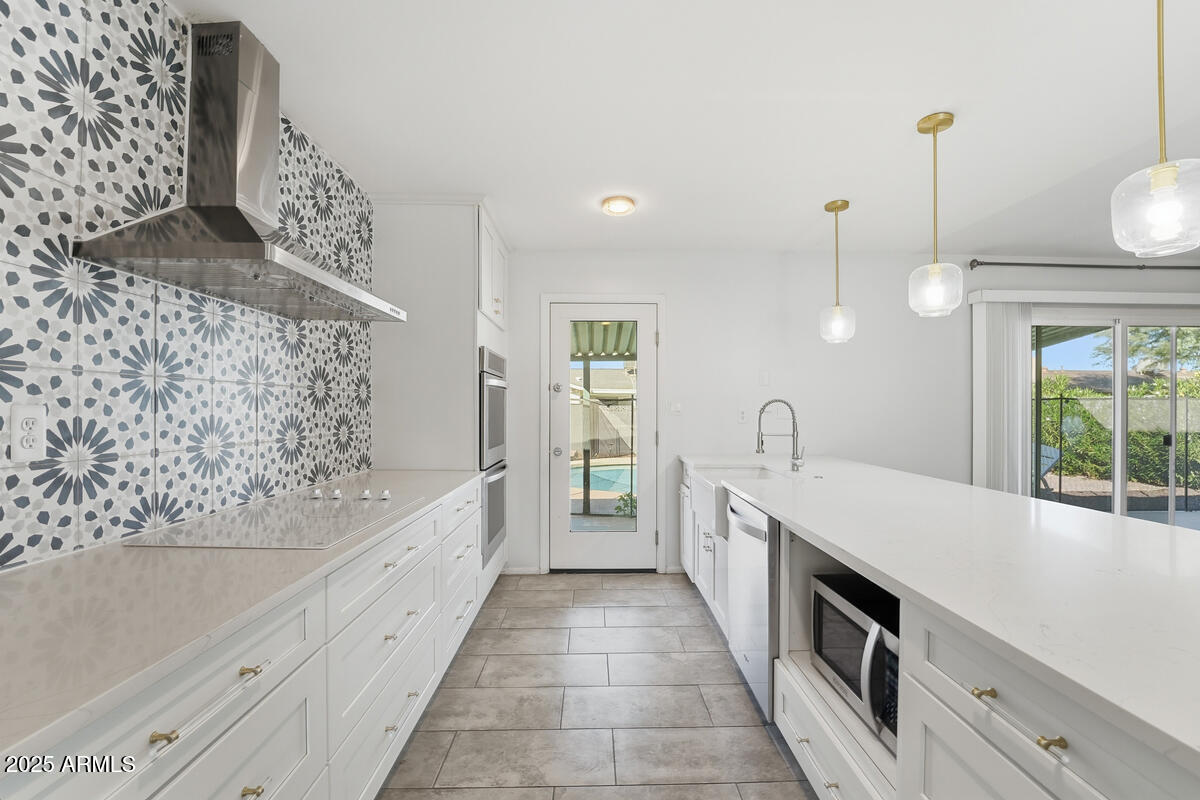 1644 East Broadmor Drive Tempe, AZ 85282 - Photo 35 of 49 a large white kitchen with a stove and a bathtub