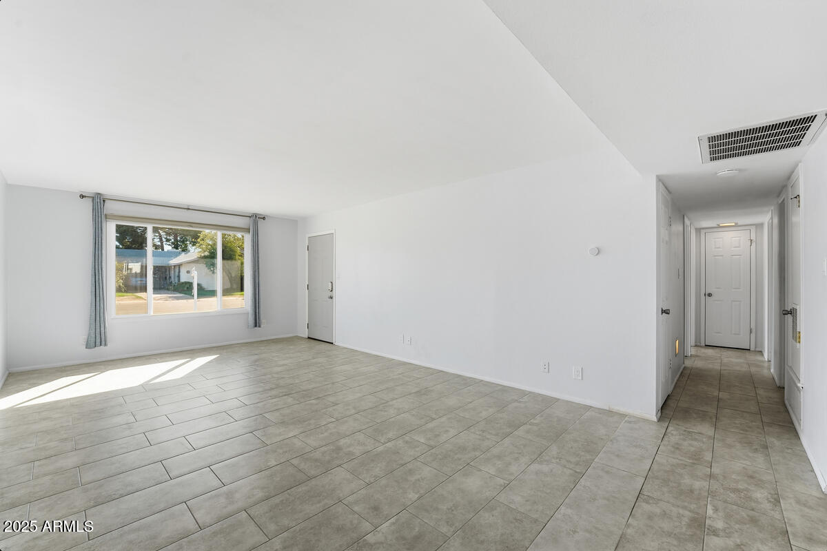 1644 East Broadmor Drive Tempe, AZ 85282 - Photo 7 of 49 an empty room with windows and closet