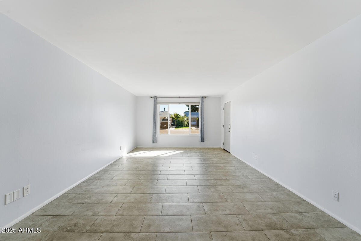 1644 East Broadmor Drive Tempe, AZ 85282 - Photo 9 of 49 an empty room with windows