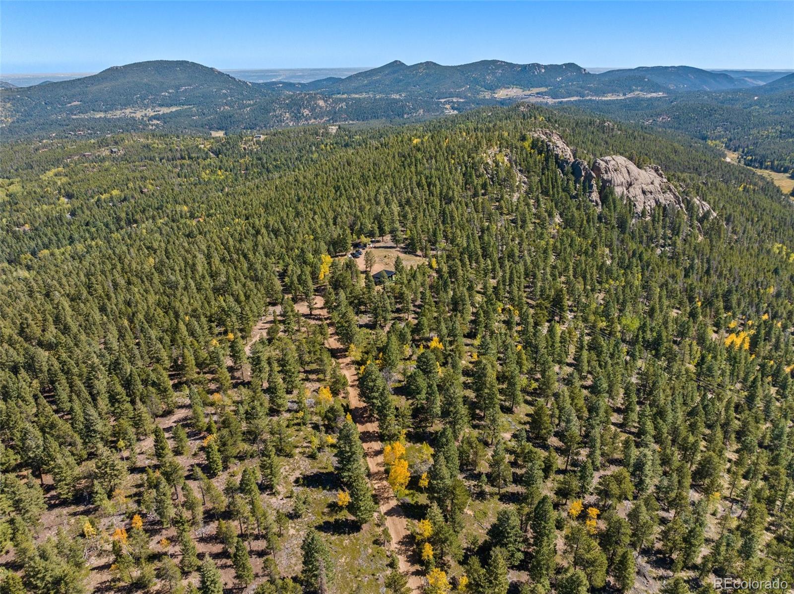 30854 Forest Shadow Trail Conifer, CO 80433 - Photo 12 of 15 a view of an mountain with a outdoor space