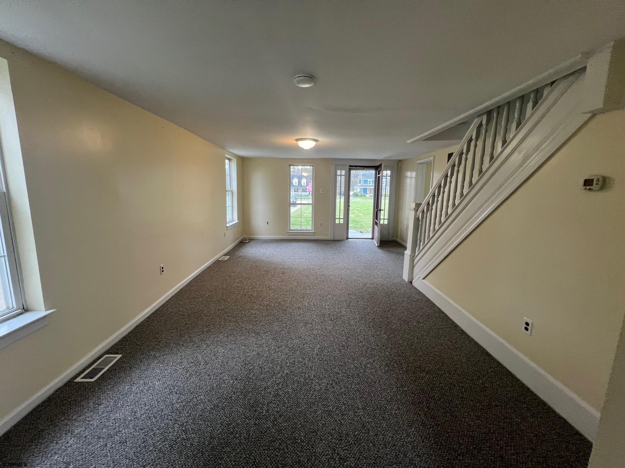219 Pleasant Mills Road Hammonton, NJ 08037 - Photo 11 of 14 a view of a livingroom with stairs and a window