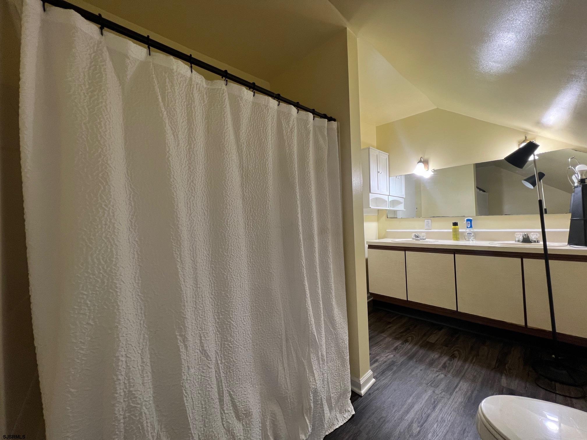 219 Pleasant Mills Road Hammonton, NJ 08037 - Photo 14 of 14 a kitchen with a sink a refrigerator a window and cabinets