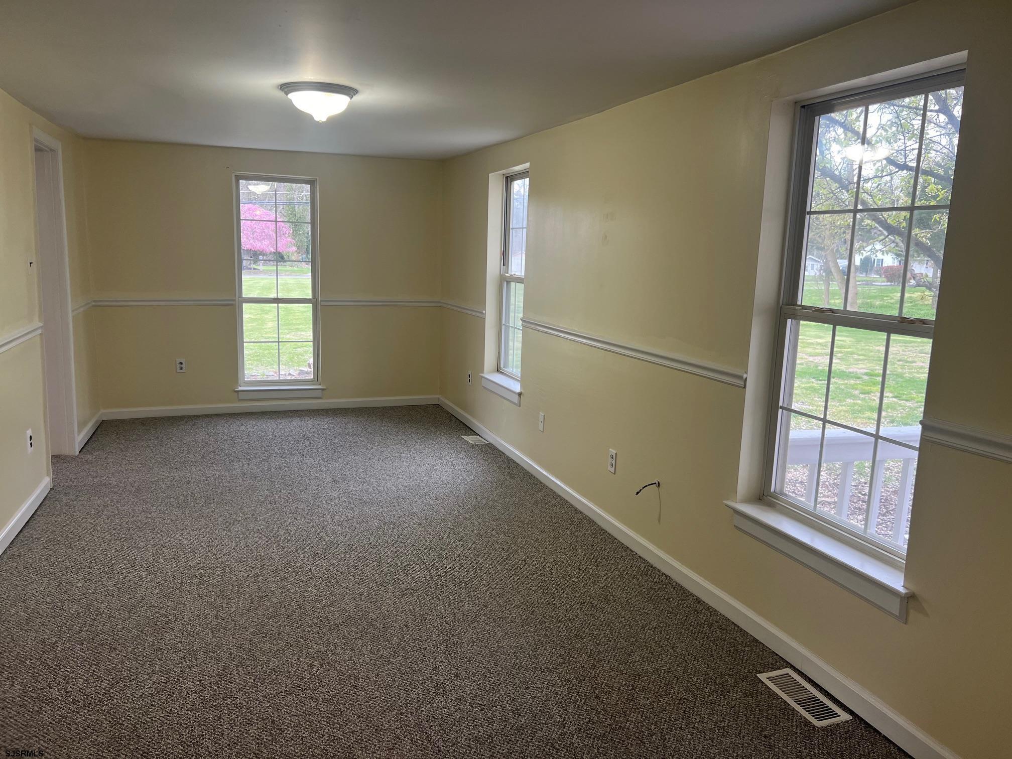 219 Pleasant Mills Road Hammonton, NJ 08037 - Photo 2 of 14 an empty room with windows
