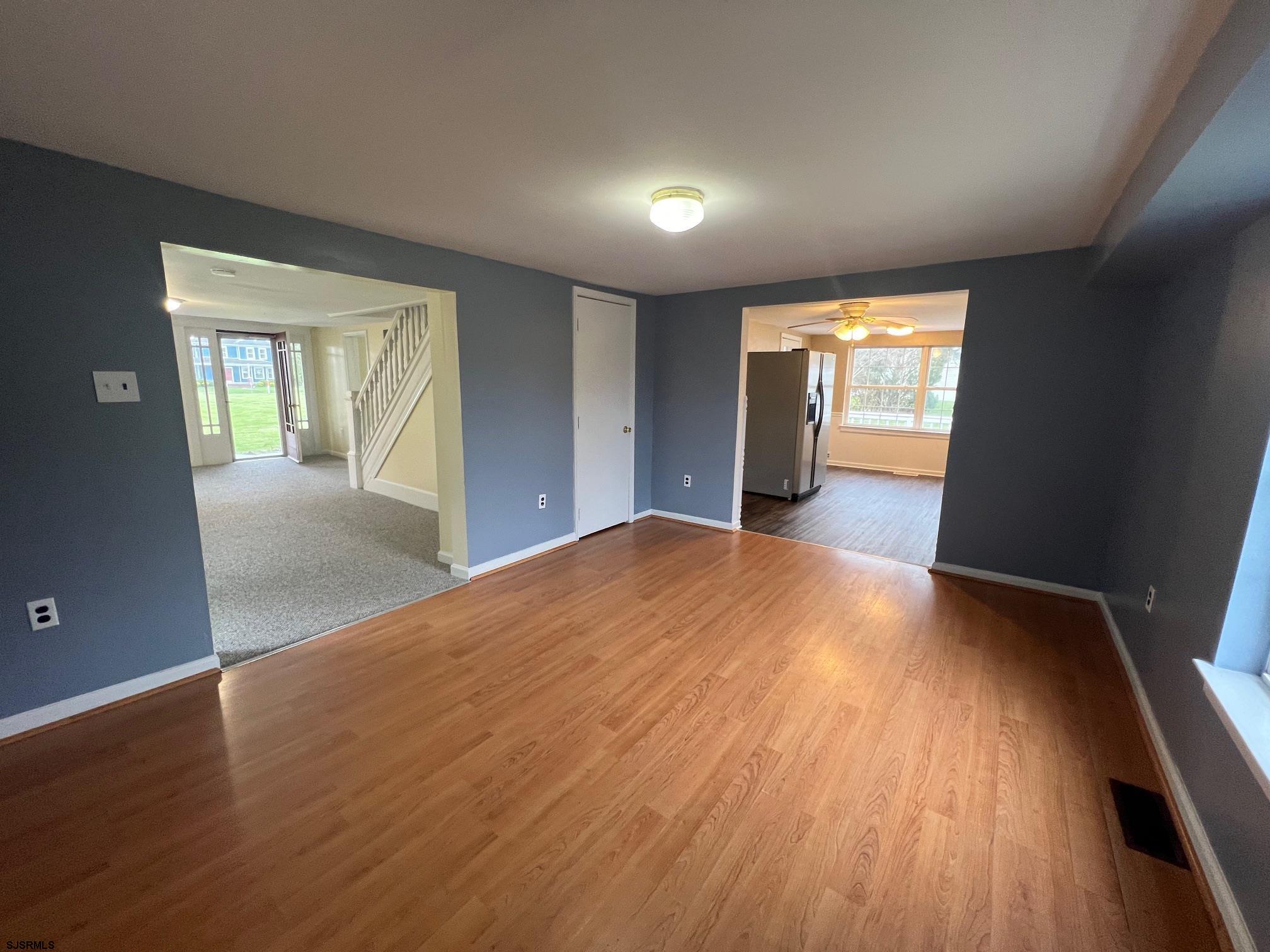 219 Pleasant Mills Road Hammonton, NJ 08037 - Photo 6 of 14 an empty room with wooden floor and windows