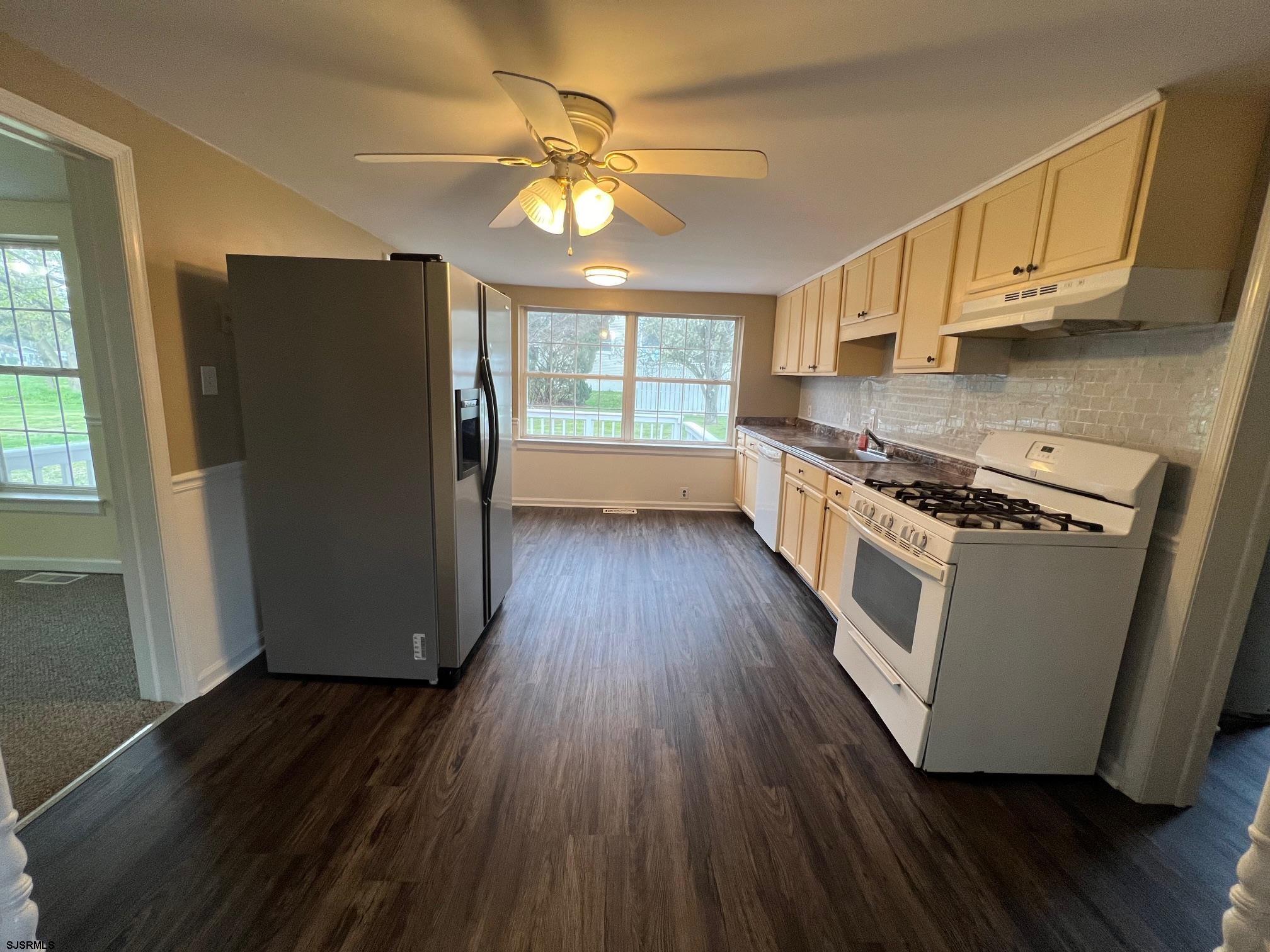 219 Pleasant Mills Road Hammonton, NJ 08037 - Photo 7 of 14 a kitchen with wooden floors and appliances
