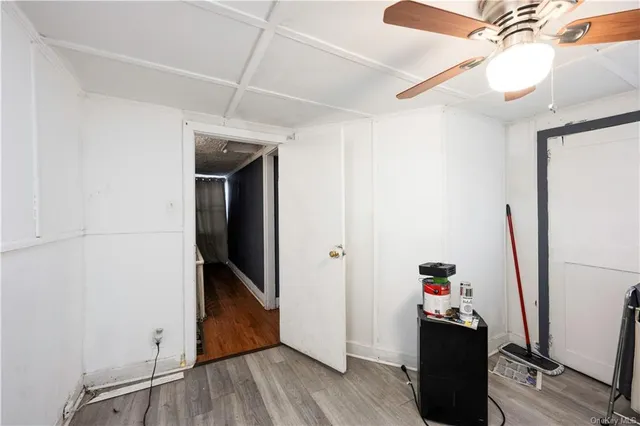 a view of a storage & utility room with wooden floor