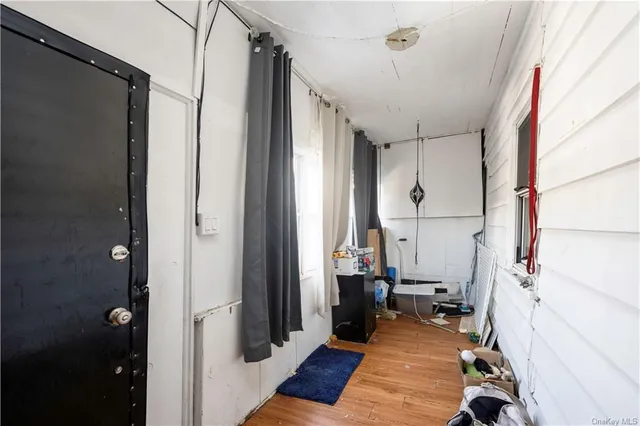 a view of a bathroom with tub and windows
