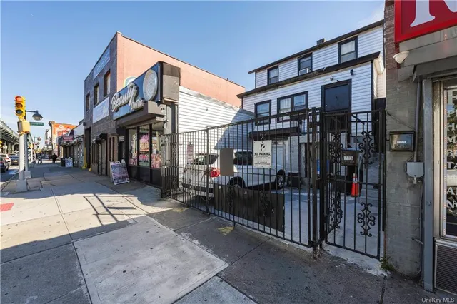 a view of a building with a bench in front of building