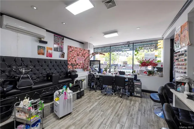 a living room with lots of furniture and a large window