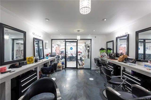 a living room with furniture a flat screen tv and a large window