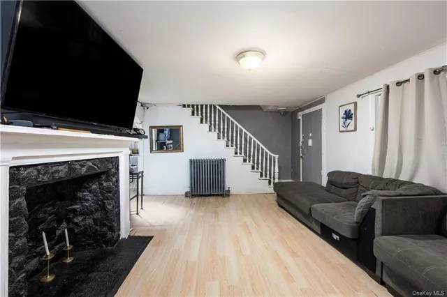 a living room with furniture and a fireplace