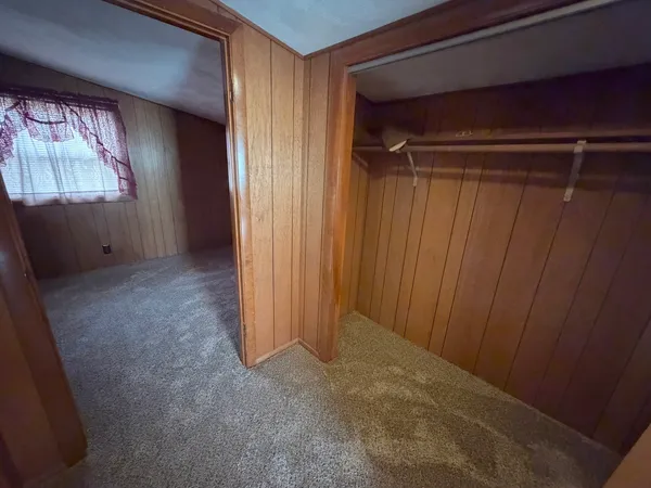 a bathroom with a sink a toilet a mirror and shower