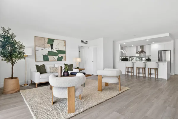 a living room with furniture and a table