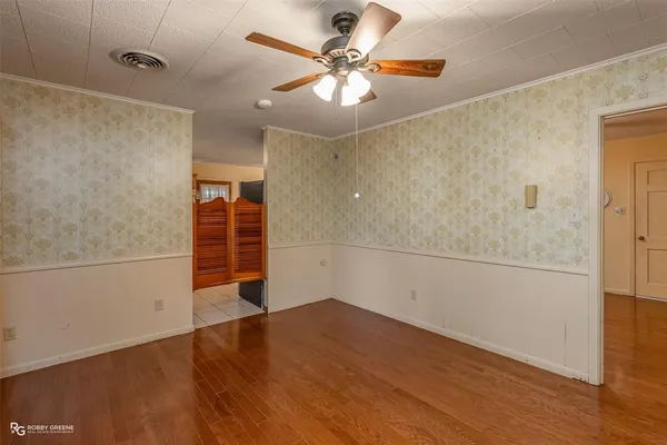 a view of a livingroom with wooden floor