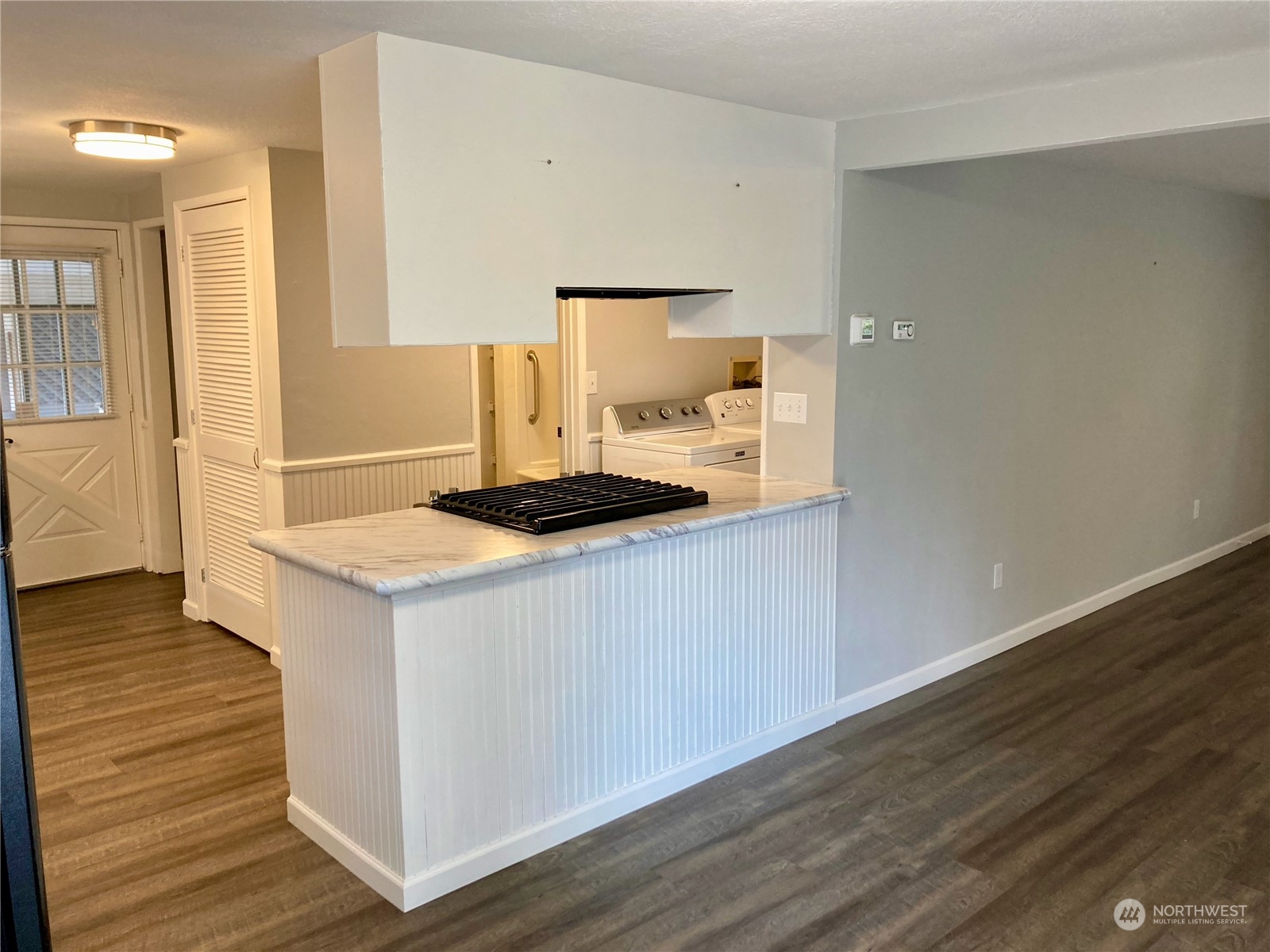 522 Centre Street La Conner, WA 98257 - Photo 11 of 30 a kitchen with a sink and wooden floor