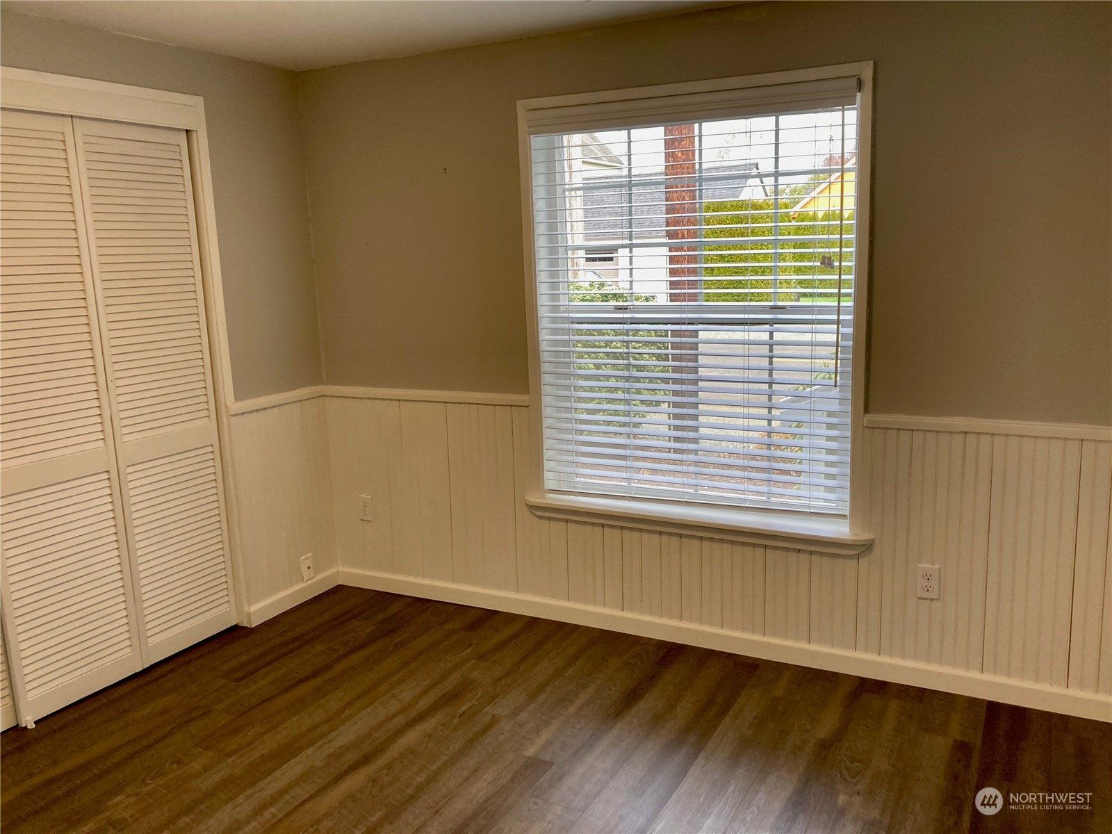 522 Centre Street La Conner, WA 98257 - Photo 20 of 30 a view of an empty room with wooden floor and a window