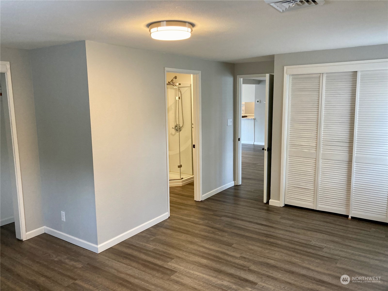 522 Centre Street La Conner, WA 98257 - Photo 6 of 30 an empty room with wooden floor & closet area