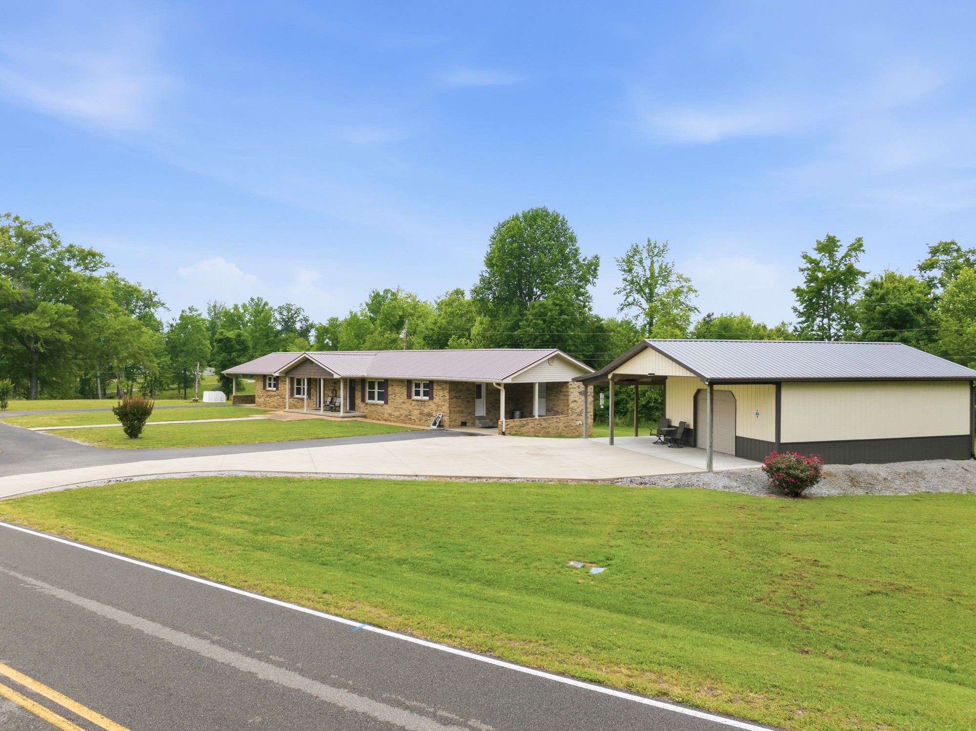 944 Brooksie Thompson Road Decaturville, TN 38329 - Photo 2 of 47 a front view of a house with a yard