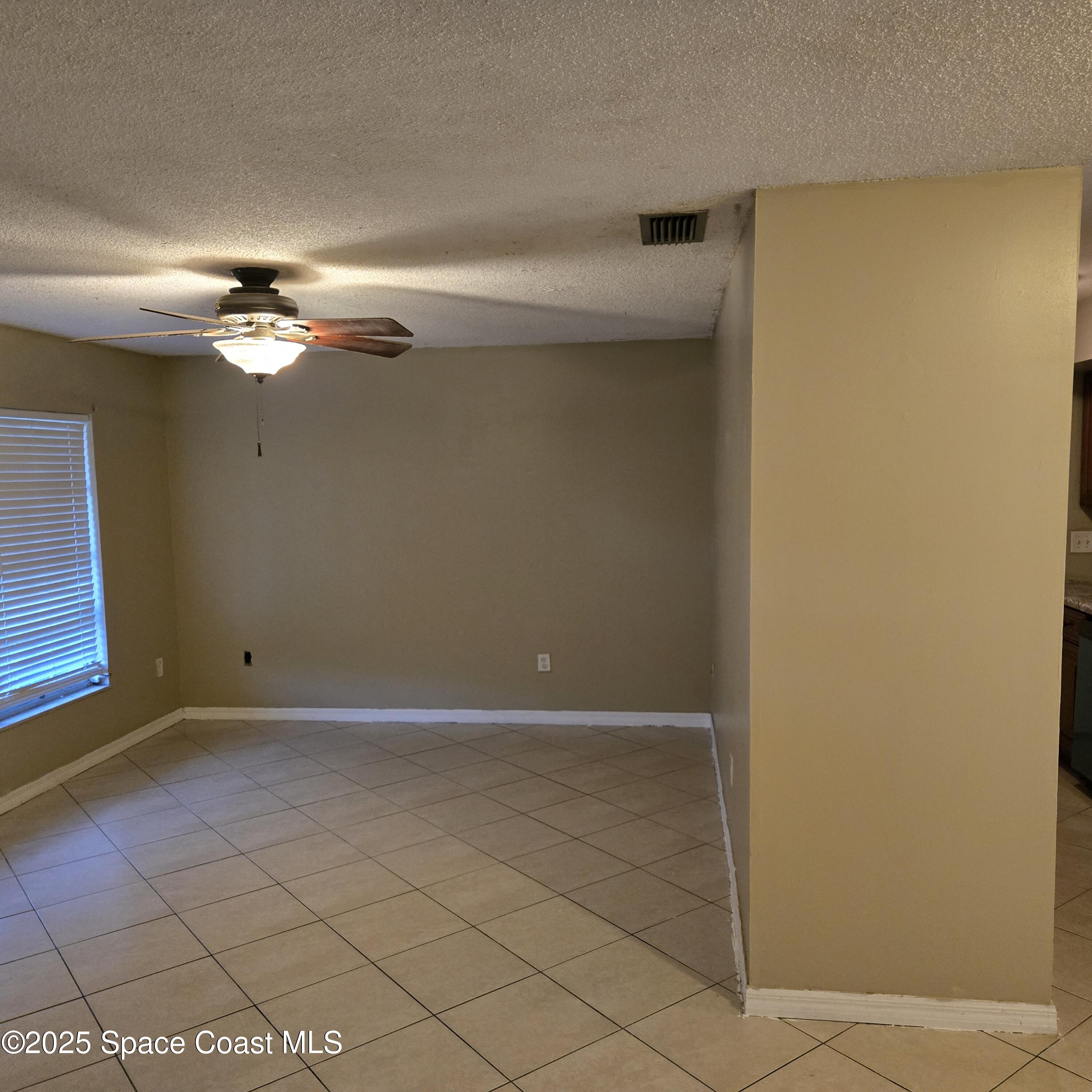 349 El Rancho Terrace Northeast Palm Bay, FL 32907 - Photo 6 of 9 a view of an empty room
