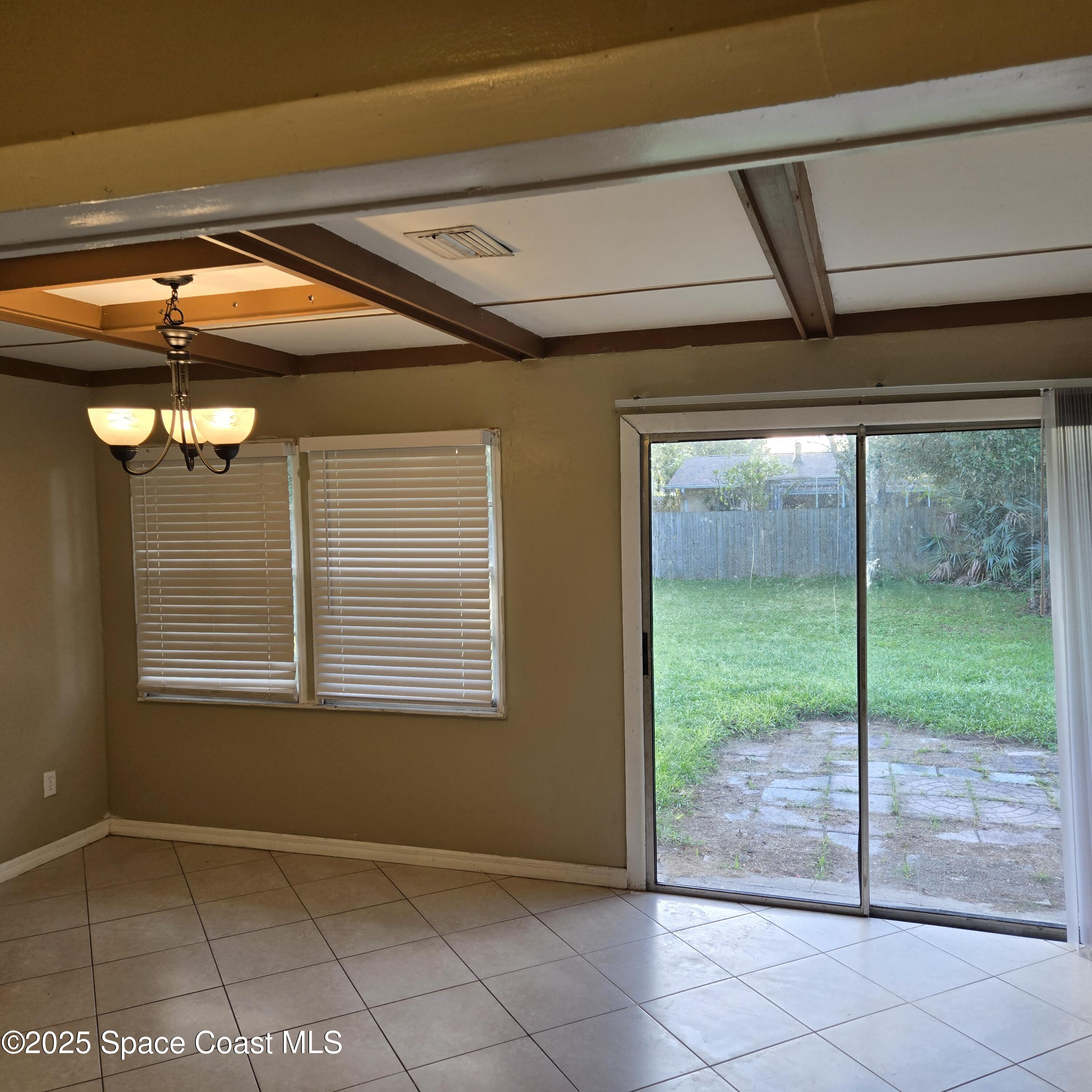 349 El Rancho Terrace Northeast Palm Bay, FL 32907 - Photo 8 of 9 a view of an empty room with windows