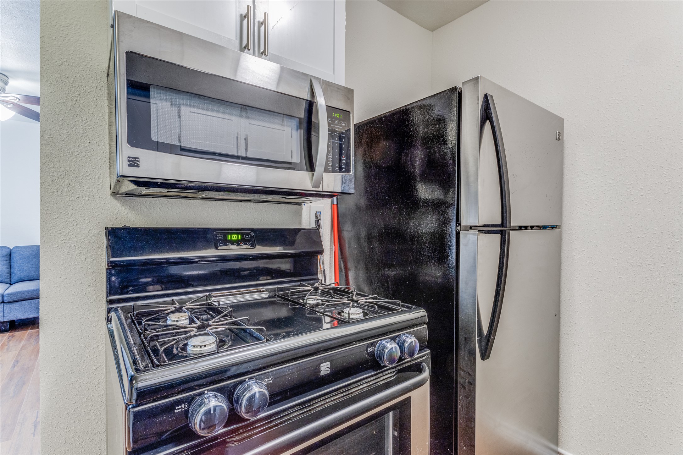 2401 Manor Road, Unit 113 Austin, TX 78722 - Photo 6 of 12 Kitchen featuring appliances with stainless steel finishes and a ceiling fan