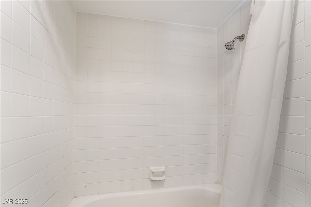 2755 Carnation Lane Henderson, NV 89074 - Photo 25 of 42 Bathroom featuring shower / bath combo with shower curtain