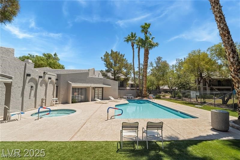 2755 Carnation Lane Henderson, NV 89074 - Photo 37 of 42 Community pool with a patio area and a community hot tub
