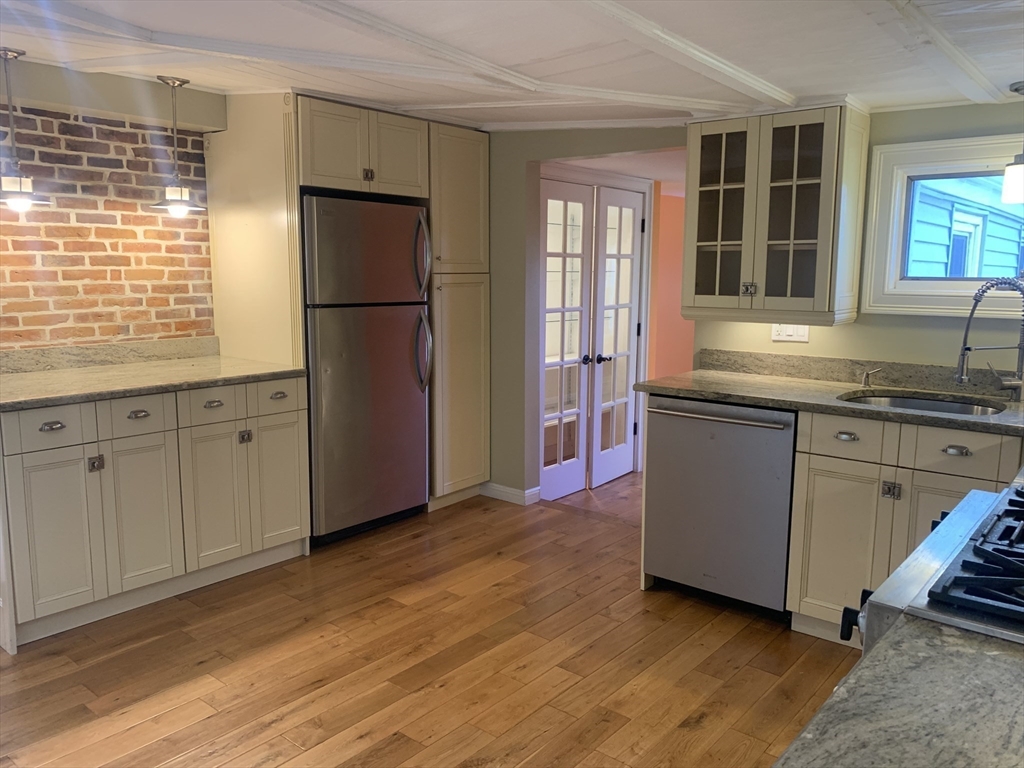 10 Salem St Avenue, Unit 2 Boston, MA 02129 - Photo 1 of 32 a kitchen with stainless steel appliances granite countertop a refrigerator a sink and a granite counter tops