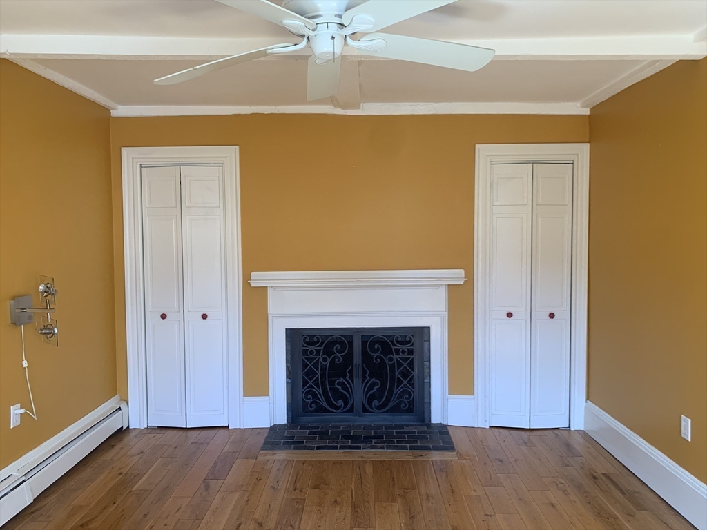 10 Salem St Avenue, Unit 2 Boston, MA 02129 - Photo 15 of 32 wooden floor fireplace and natural light