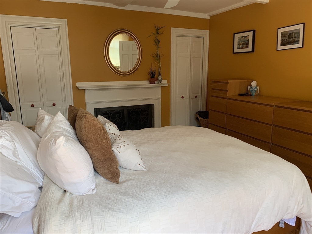 10 Salem St Avenue, Unit 2 Boston, MA 02129 - Photo 16 of 32 a bedroom with a bed and a potted plant