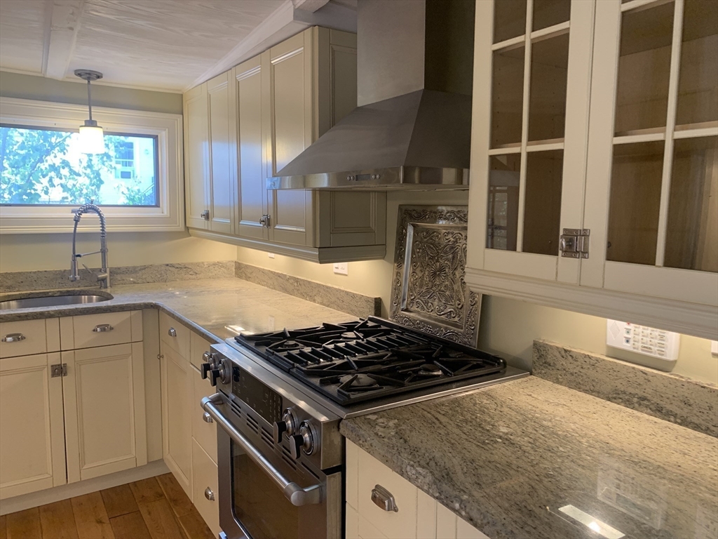 10 Salem St Avenue, Unit 2 Boston, MA 02129 - Photo 2 of 32 a kitchen with a stove and a sink