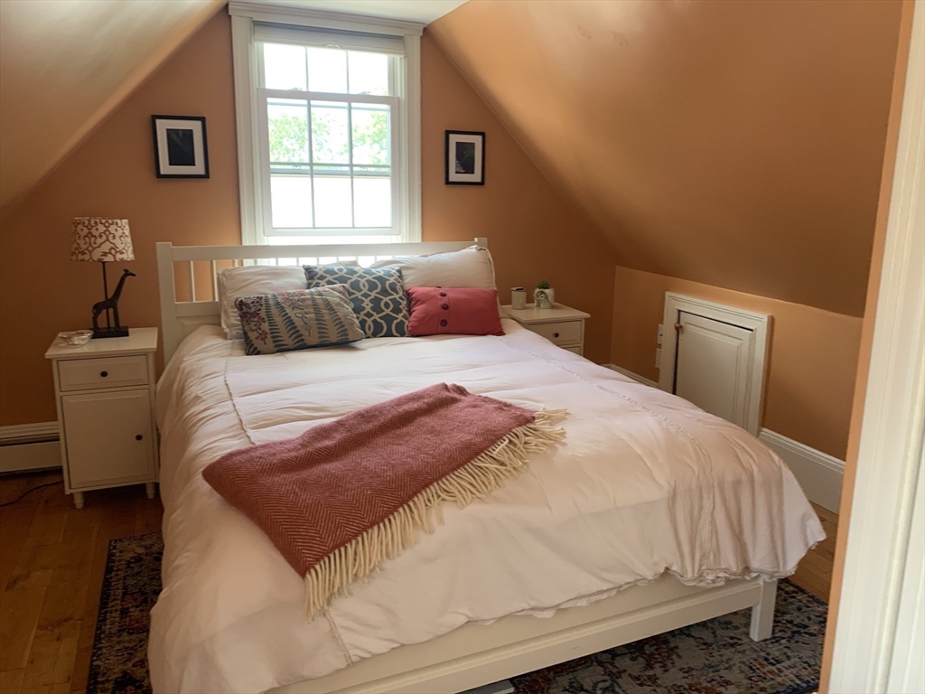 10 Salem St Avenue, Unit 2 Boston, MA 02129 - Photo 26 of 32 a bedroom with a bed and wooden floor