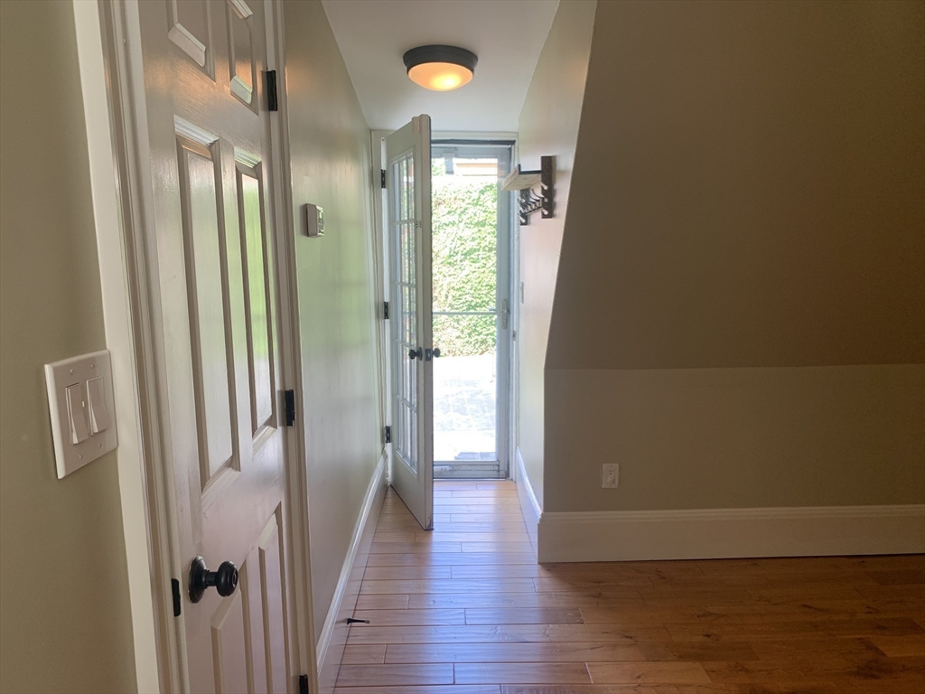 10 Salem St Avenue, Unit 2 Boston, MA 02129 - Photo 30 of 32 a view of a hallway with wooden floor and glass doors