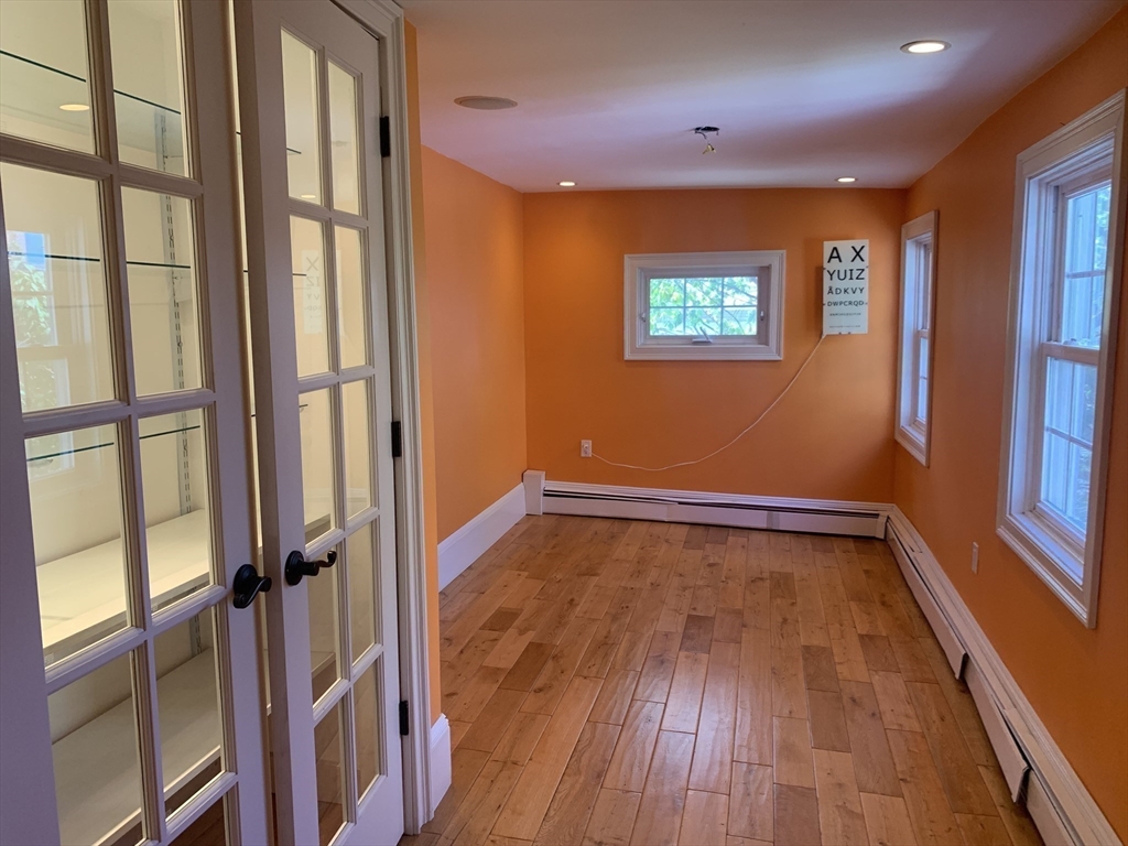 10 Salem St Avenue, Unit 2 Boston, MA 02129 - Photo 5 of 32 a view of an empty room with wooden floor and a window