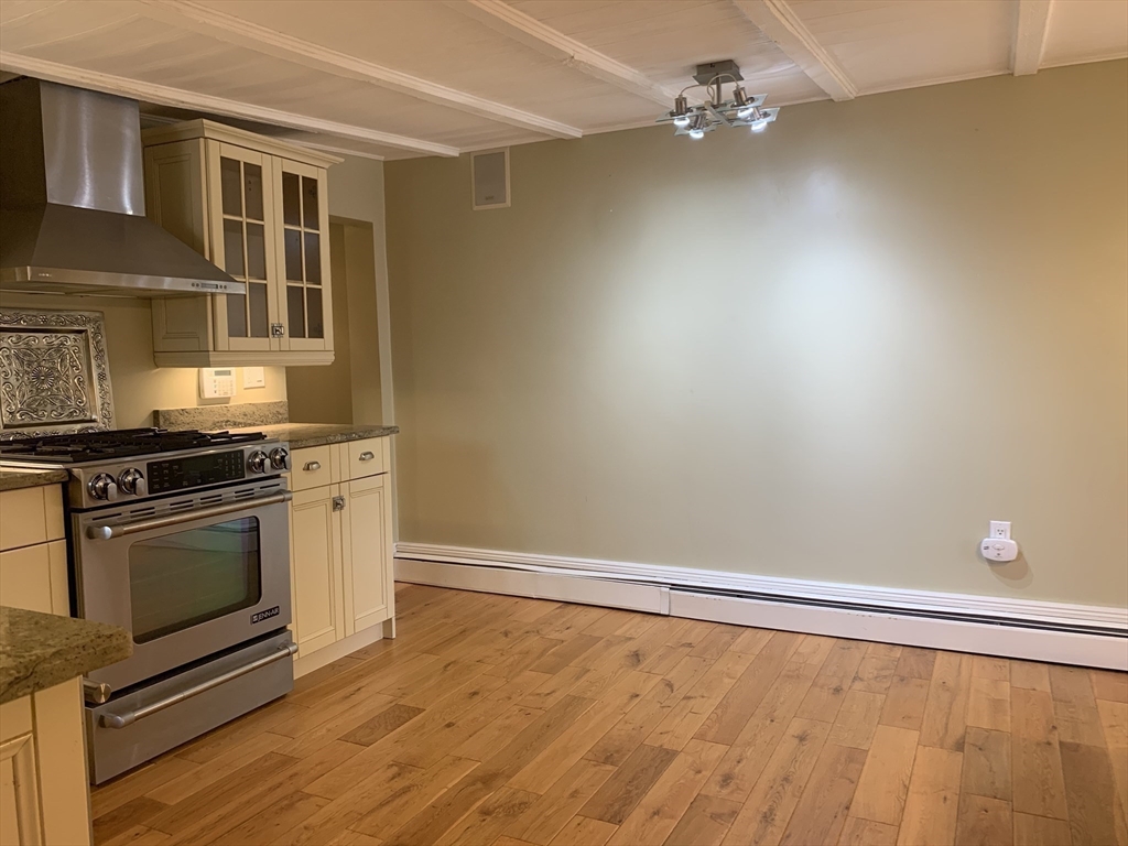 10 Salem St Avenue, Unit 2 Boston, MA 02129 - Photo 7 of 32 a kitchen with granite countertop a stove and a sink