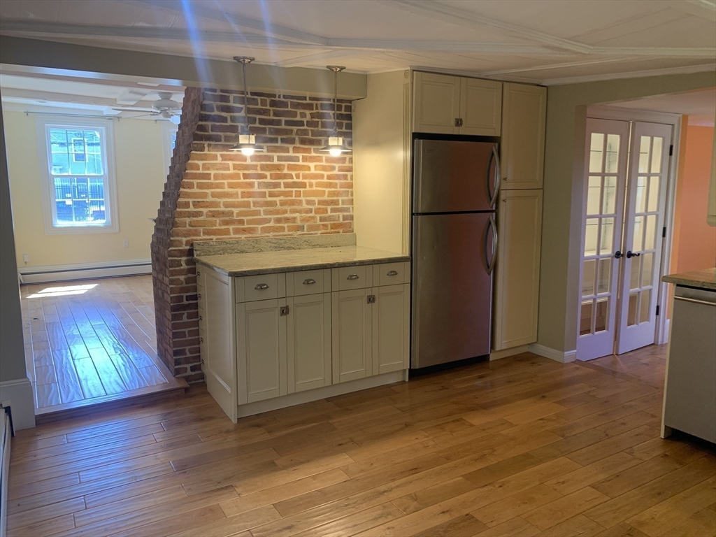 10 Salem St Avenue, Unit 2 Boston, MA 02129 - Photo 8 of 32 a kitchen with stainless steel appliances granite countertop a refrigerator and a sink