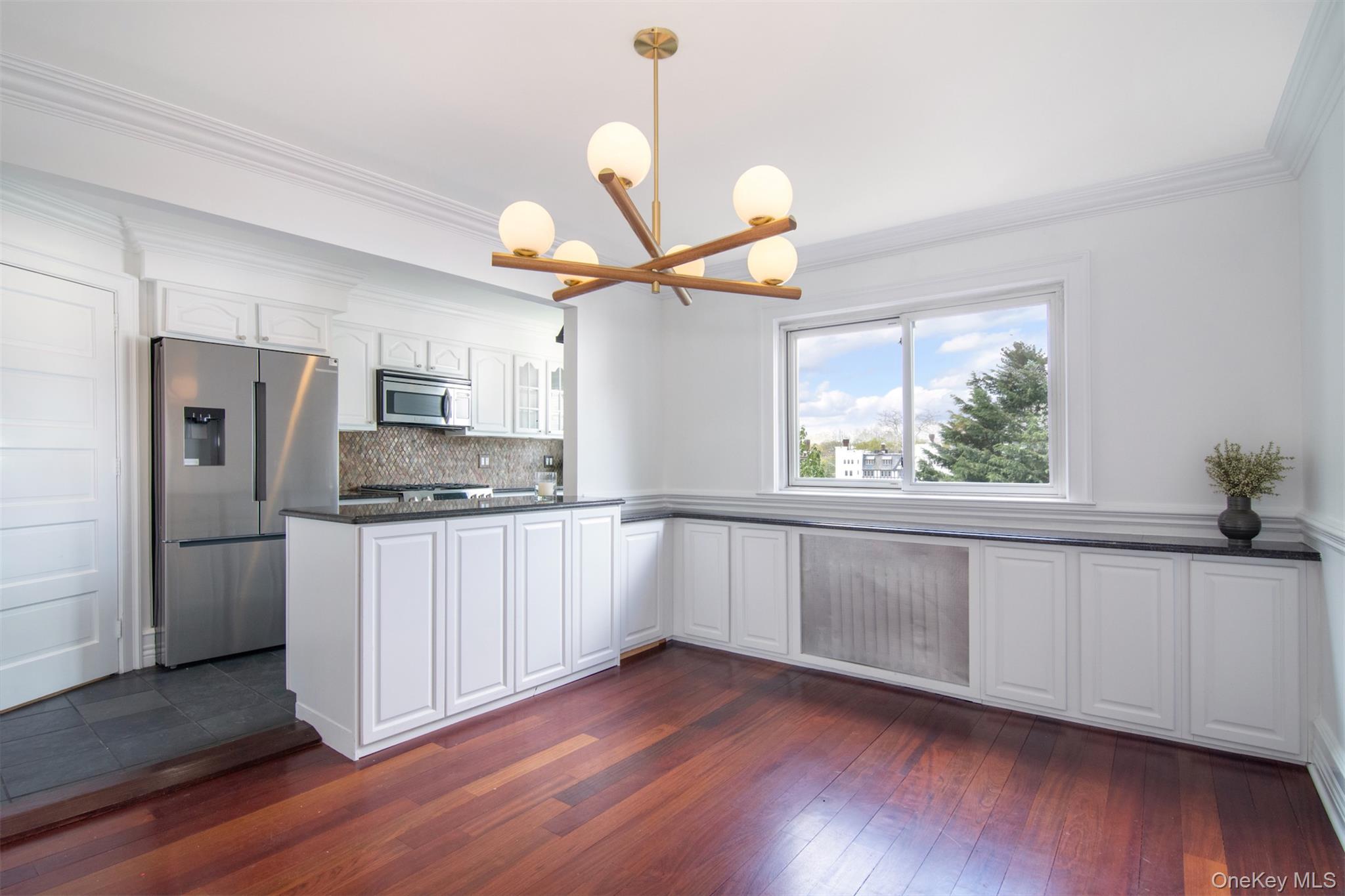 41 Sagamore Road Bronxville, NY 10708 - Photo 11 of 38 Dining room with ornamental molding and hardwood floors