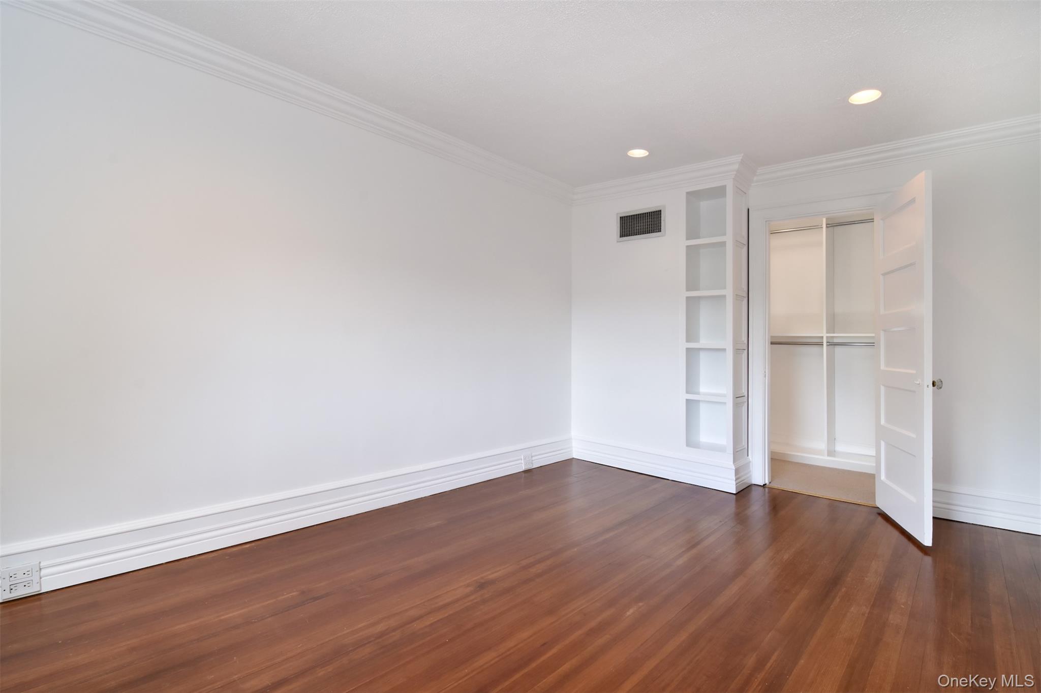 41 Sagamore Road Bronxville, NY 10708 - Photo 16 of 38 Primary bedroom with walk in closet and built in book shelves