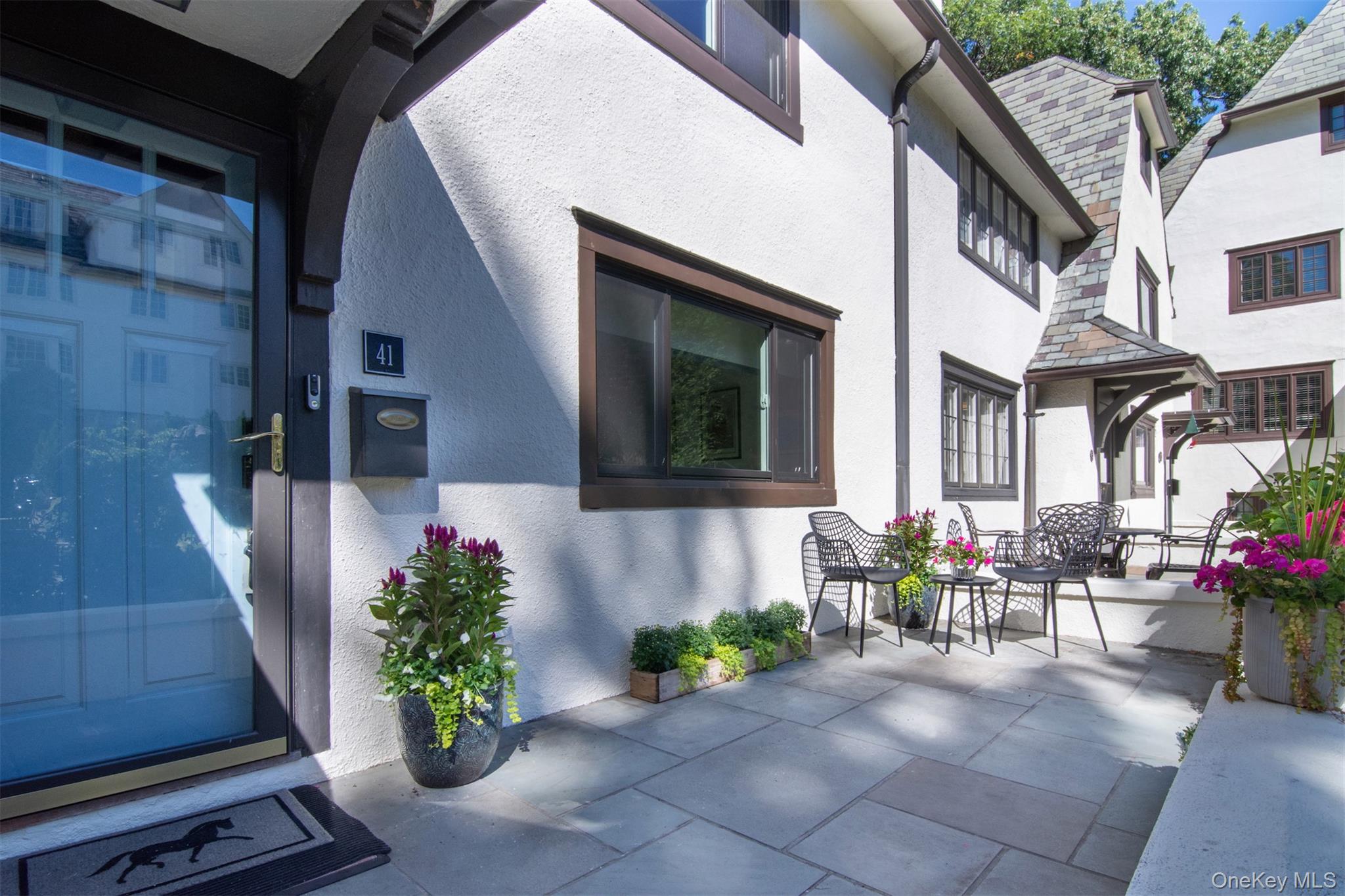 41 Sagamore Road Bronxville, NY 10708 - Photo 3 of 38 View front of home with flagstone patio and stucco siding
