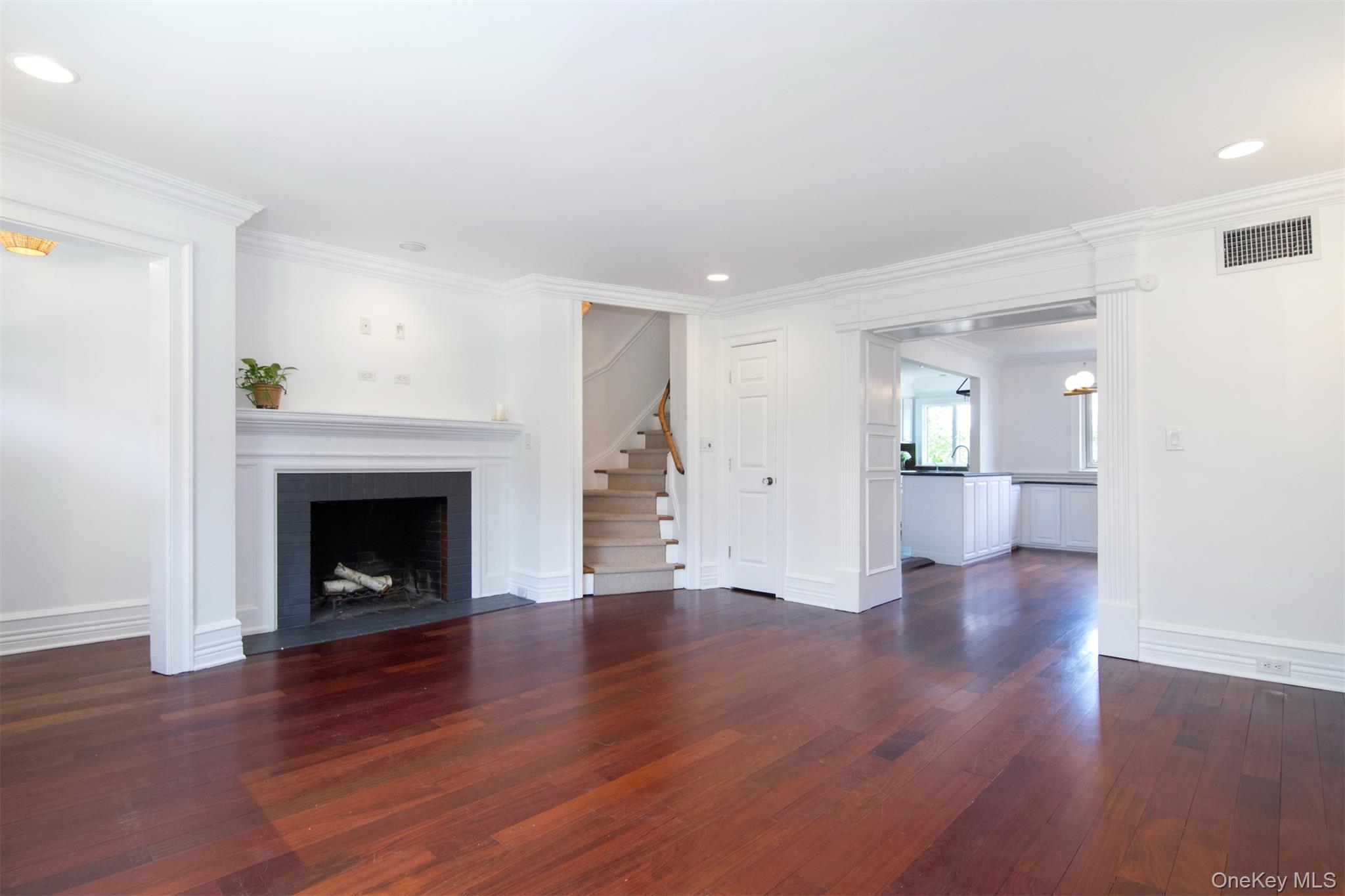 41 Sagamore Road Bronxville, NY 10708 - Photo 7 of 38 Living room with stairs, hardwood floors, ornamental molding, recessed lighting