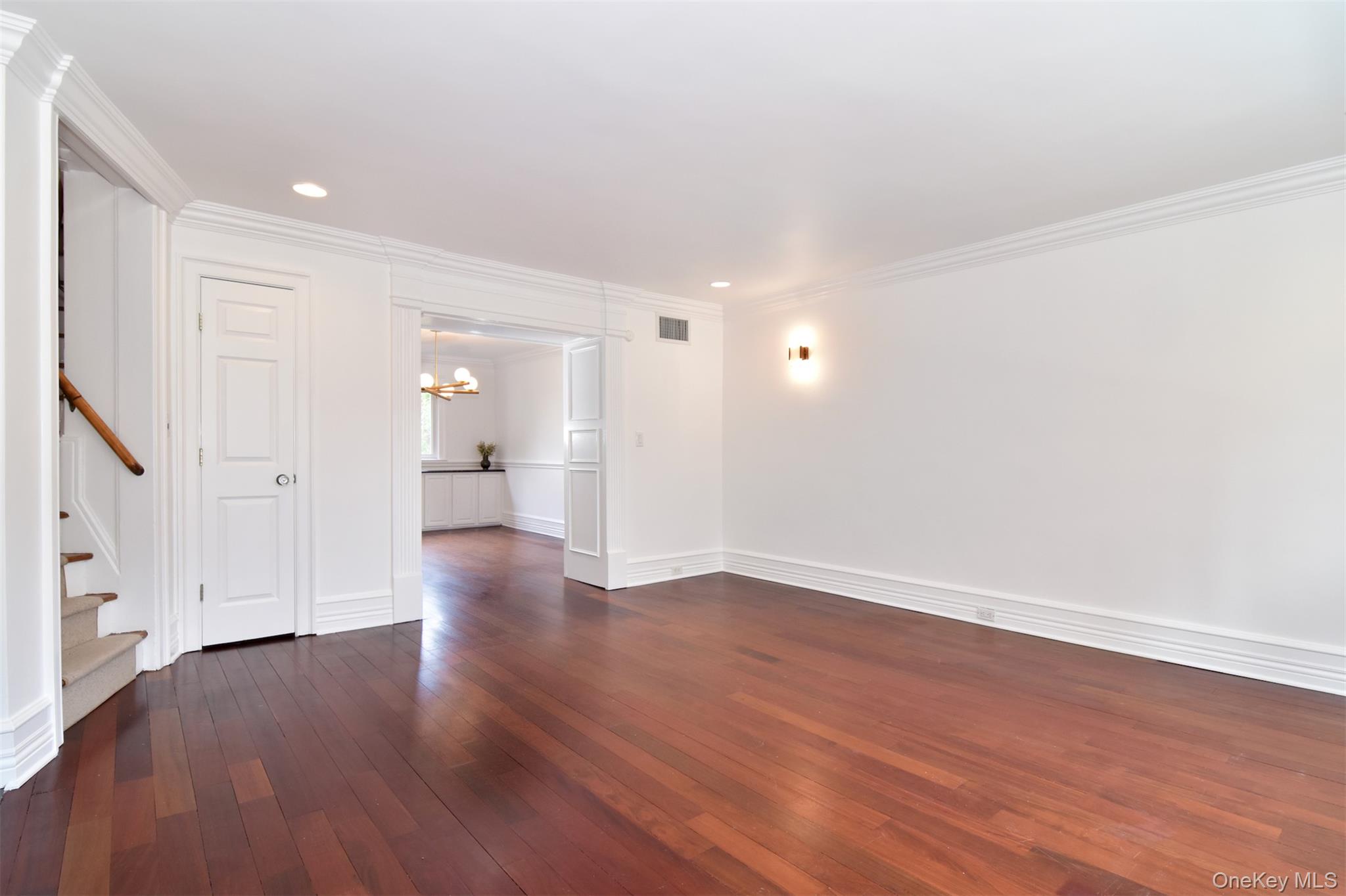 41 Sagamore Road Bronxville, NY 10708 - Photo 8 of 38 Living room with stairs, hardwood floors, ornamental molding, recessed lighting