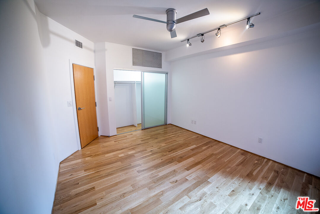 8 Brooks Avenue, Unit 10 Venice, CA 90291 - Photo 11 of 15 a view of empty room with wooden floor