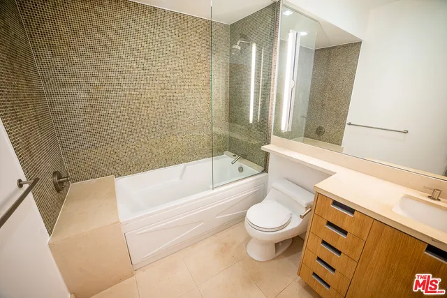 a bathroom with a toilet and a bathtub