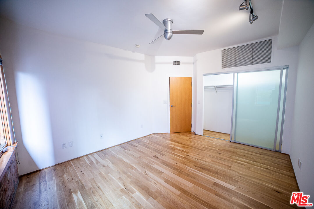 8 Brooks Avenue, Unit 10 Venice, CA 90291 - Photo 9 of 15 a view of empty room with wooden floor