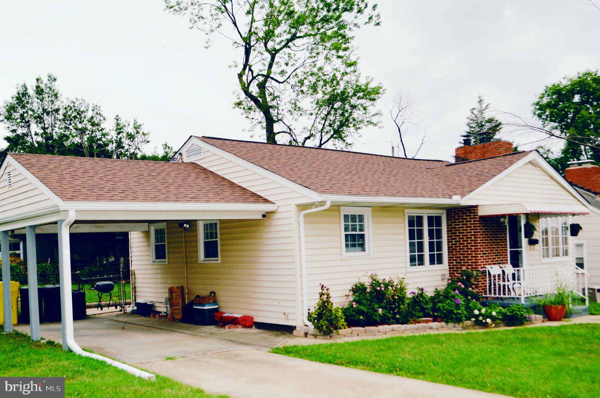 203 Mountain Road Linthicum, MD 21090 - Photo 2 of 17 a front view of a house with a yard and trees