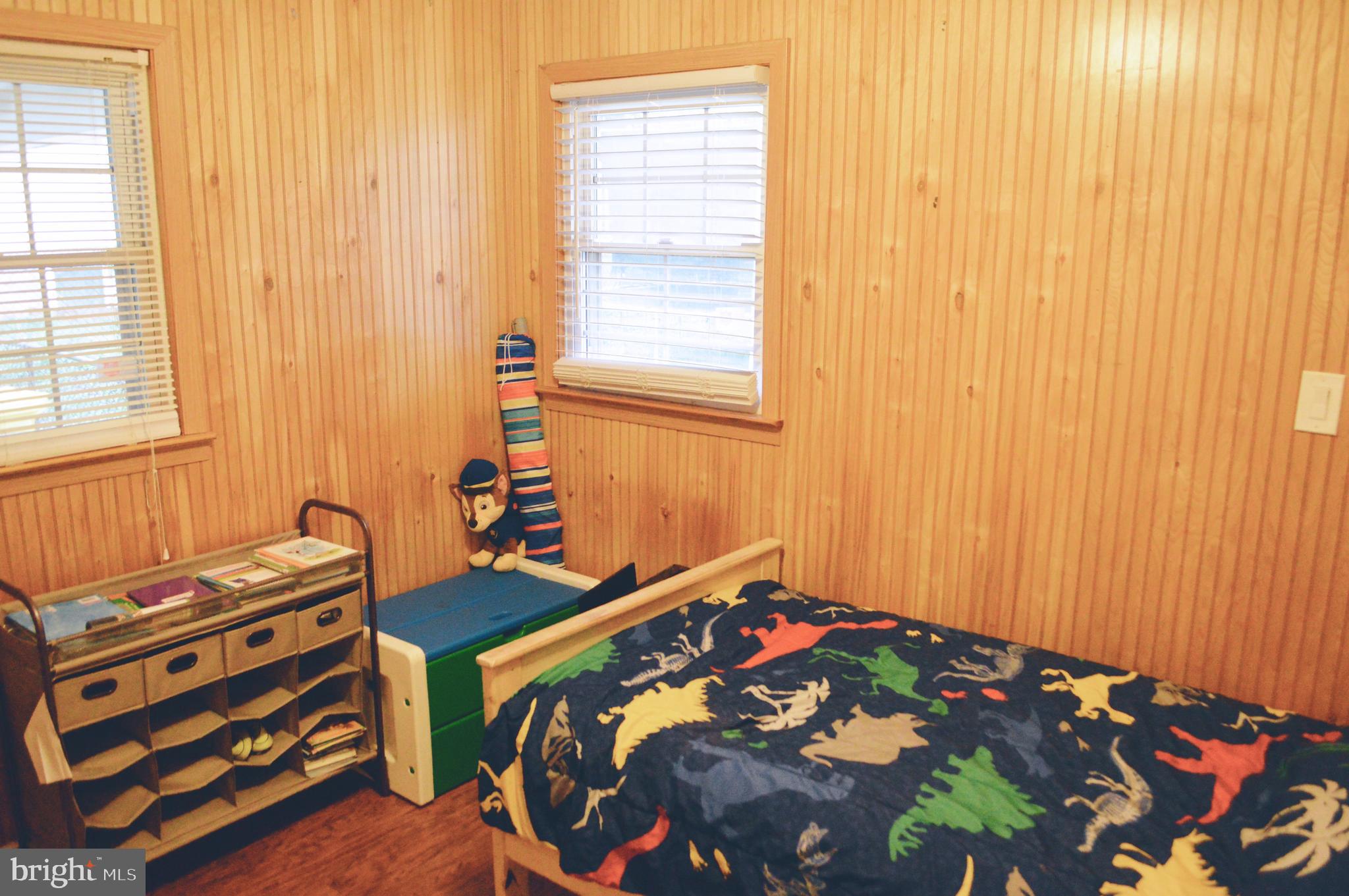 203 Mountain Road Linthicum, MD 21090 - Photo 11 of 17 a bedroom with a bed and a window