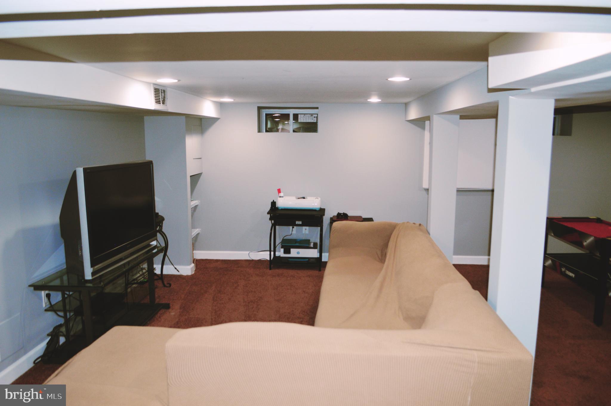 203 Mountain Road Linthicum, MD 21090 - Photo 13 of 17 a living room with furniture and a flat screen tv