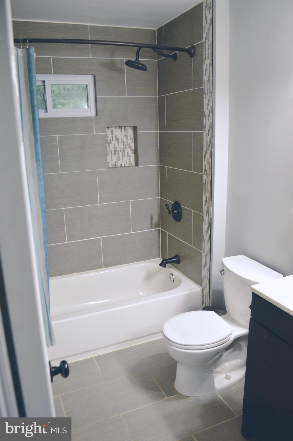 203 Mountain Road Linthicum, MD 21090 - Photo 17 of 17 a bathroom with a toilet and a shower